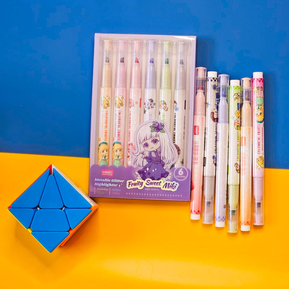 Set of 6 colorful metallic glitter highlighter pens for kids, packaged in two pastel-themed boxes labeled “Fruity Sweet Mix.” Each pen features cute cartoon character prints and soft, vibrant ink colors perfect for journaling, school projects, or creative doodling. The packaging is designed with anime-style illustrations of girls in whimsical outfits, appealing to children and stationery lovers. Displayed on a dual-tone yellow and blue background, this pen set makes a fun and eye-catching gift for birthdays